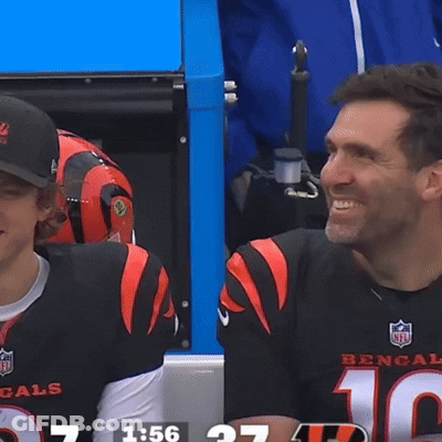 Man In Bengals Jersey Talking To Man In Black Shirt GIF