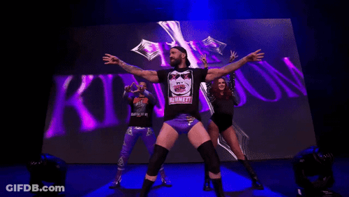Man In Bennett Shirt In Front Of Crowd GIF