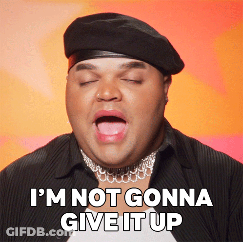 Man In Beret And Choker Saying Not Giving Up GIF
