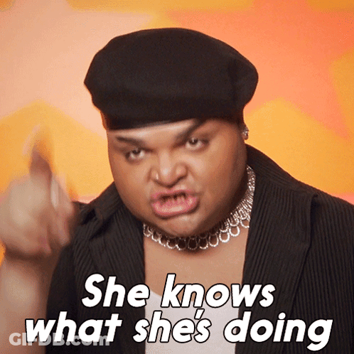 Man In Beret Saying She Knows What She's Doing GIF
