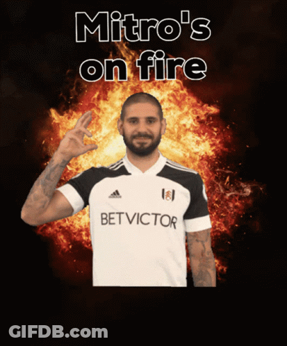 Man In Bet Victor Shirt In Front Of Flames GIF