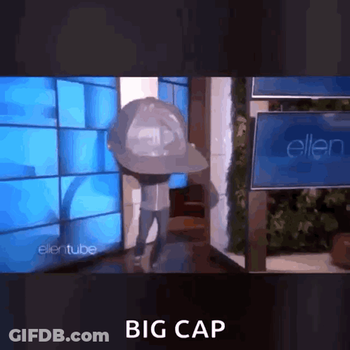 Man In Big Hat In Front Of Ellentube Sign GIF
