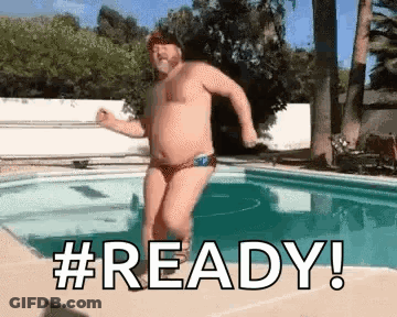 Man In Bikini Jumping Into Swimming Pool GIF