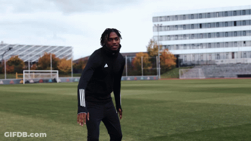 Man In Black Adidas Hoodie On Soccer Field GIF