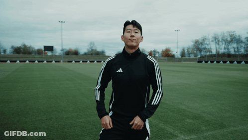 Man In Black Adidas Jacket On Soccer Field GIF