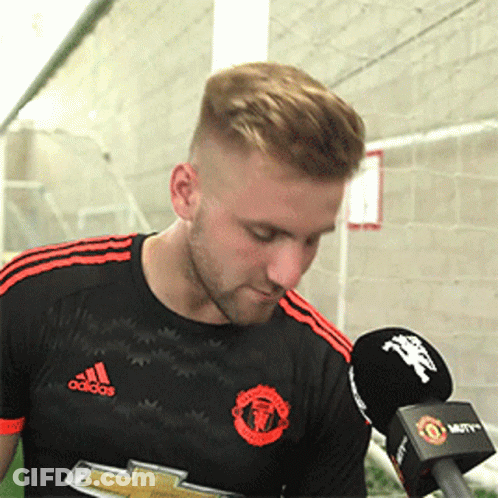 Man In Black Adidas Shirt Holding Microphone GIF