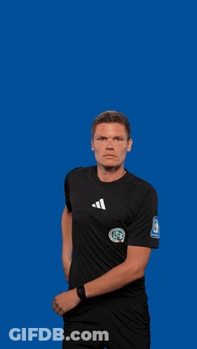 Man In Black Adidas Shirt Holding Yellow Chicken Toy GIF