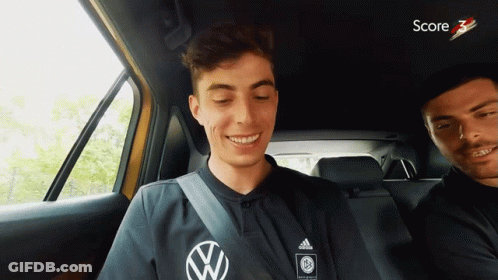 Man In Black Adidas Shirt Smiling In Car GIF