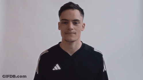 Man In Black Adidas Shirt With White Stripes GIF