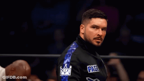 Man In Black And Blue Jacket With Page On Sleeve GIF