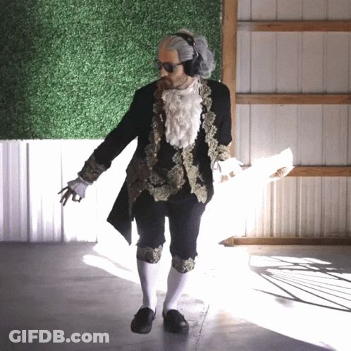 Man In Black And Gold Costume With White Socks GIF