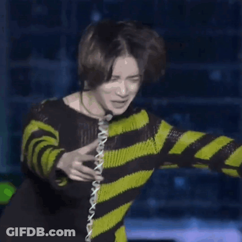 Man In Black And Green Striped Sweater Dancing GIF