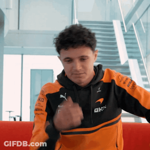 Man In Black And Orange Jacket With AKK GIF