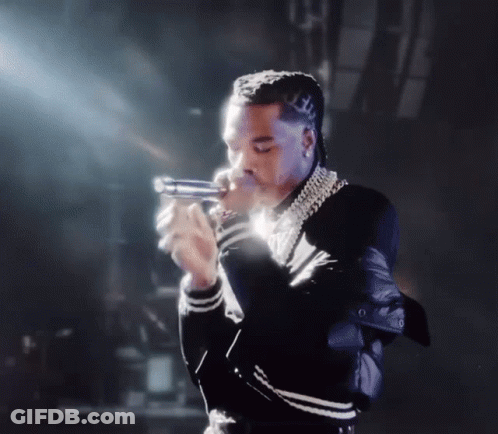 Man In Black And White Jacket Holding Gun GIF