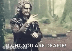 Man In Black And White Photo Pointing Saying Right You Are Dearie GIF