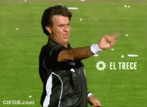 Man In Black And White Shirt Pointing At El Trece GIF