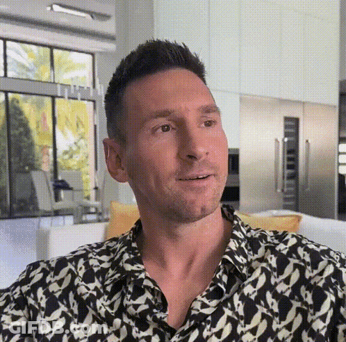 Man In Black And White Shirt Sitting On Couch GIF