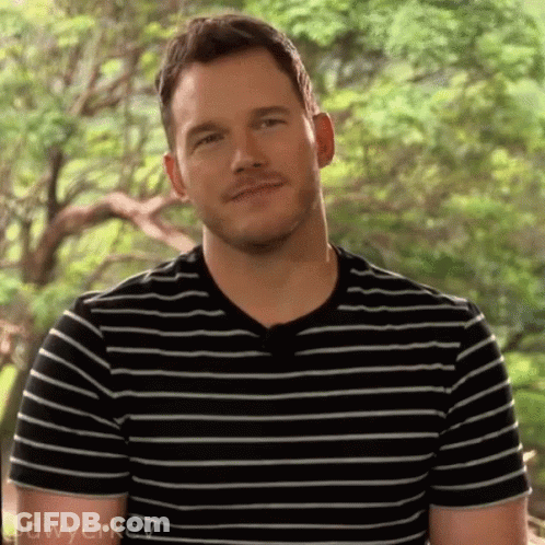 Man In Black And White Striped Shirt Smiling GIF