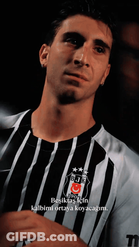 Man In Black And White Striped Shirt With BJK GIF