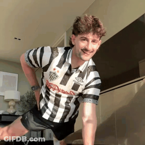 Man In Black And White Striped Umbro Shirt GIF