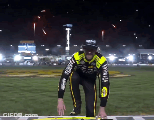 Man In Black And Yellow Outfit With Carden GIF