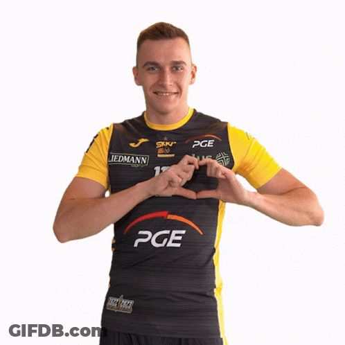 Man In Black And Yellow PGE Shirt Making Heart Shape With Hands GIF
