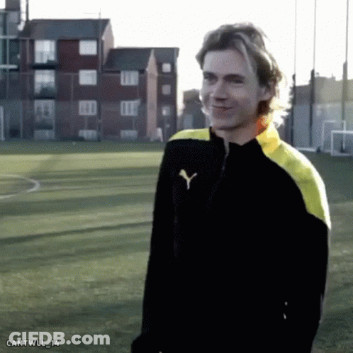 Man In Black And Yellow Puma Jacket GIF