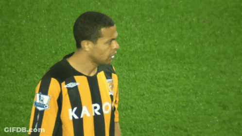 Man In Black And Yellow Striped Shirt With Karo GIF