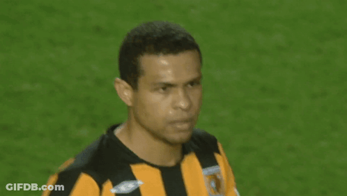 Man In Black And Yellow Striped Umbro Shirt GIF