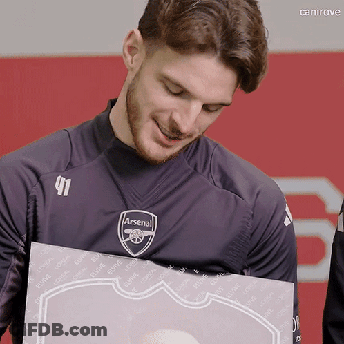 Man In Black Arsenal Shirt Holding Box GIF
