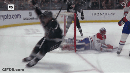 Man In Black Avalanche Hockey Shirt Running In Hallway GIF