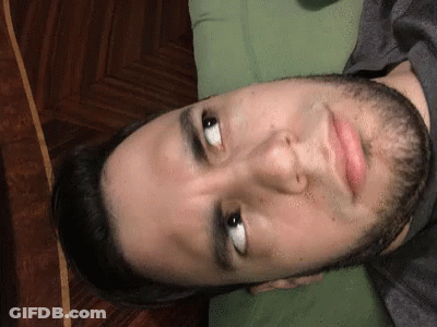 Man In Black Balenciaga Shirt On Couch GIF