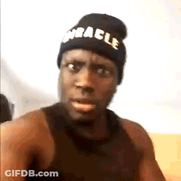 Man In Black Beanie And Tank Top Making Funny Face GIF