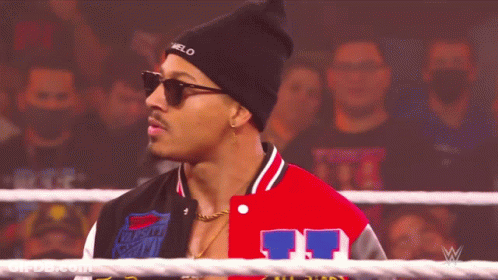 Man In Black Beanie And Varsity Jacket Number 11 GIF