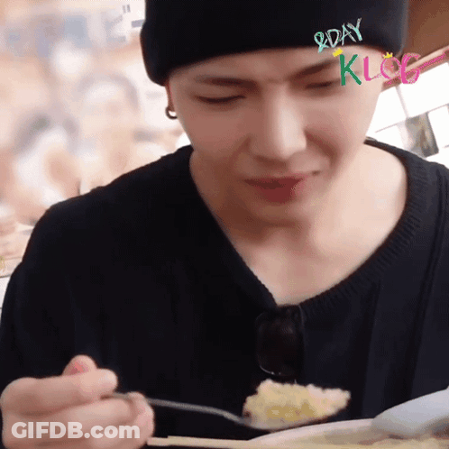 Man In Black Beanie Eating With Spoon GIF