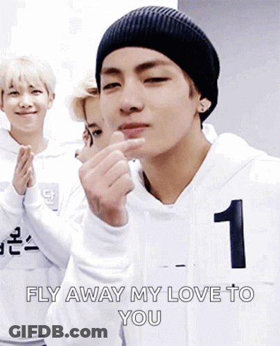 Man In Black Beanie Making Heart With Fingers GIF
