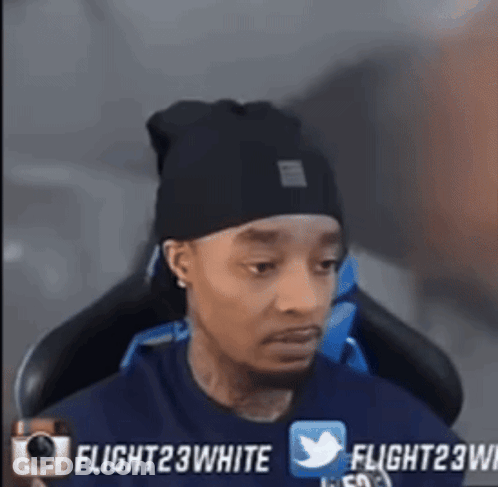 Man In Black Beanie Sitting GIF