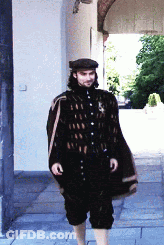 Man In Black Cape And Hat Walking GIF