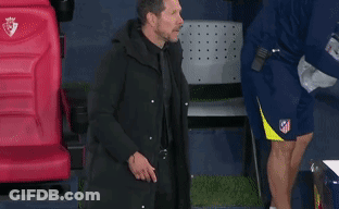 Man In Black Coat In Front Of Red Digi Seat GIF