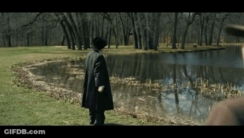 Man In Black Coat Near Lake GIF