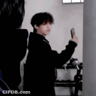 Man In Black Coat Taking Selfie GIF