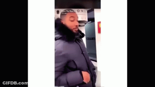 Man In Black Coat With Fur Hood GIF