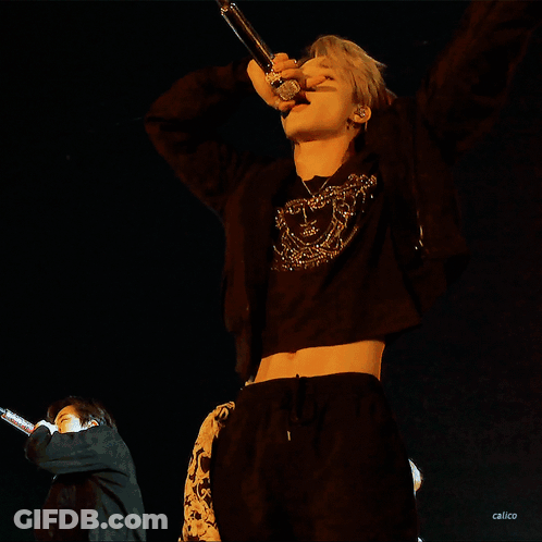 Man In Black Crop Top Singing Into Microphone GIF