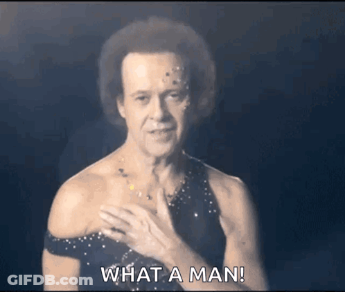 Man In Black Dress Asking What A Man Is GIF