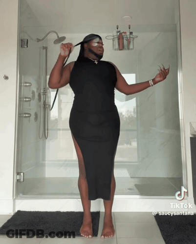Man In Black Dress Holding Shower Head With TikTok GIF