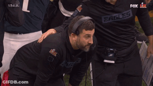 Man In Black Eagles Shirt Splashed By Fox Broadcaster GIF