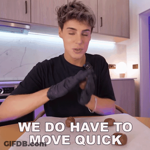 Man In Black Gloves Sitting At Table We Do Have To Move Quick GIF