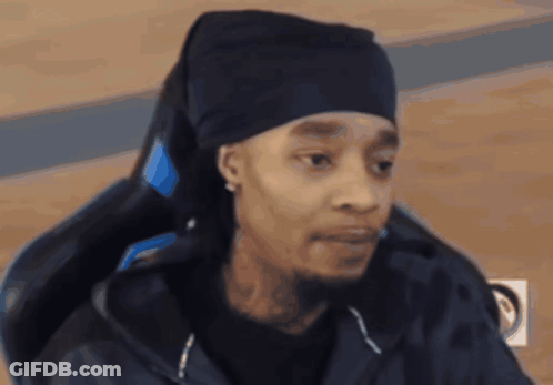 Man In Black Hat And Black Jacket Sitting In Chair GIF