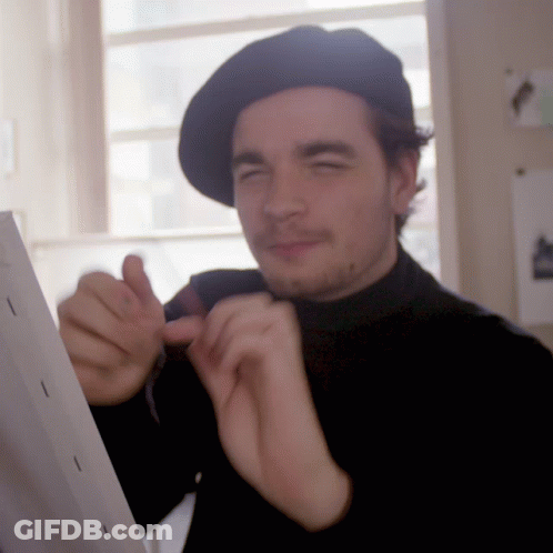 Man In Black Hat And Black Turtleneck GIF