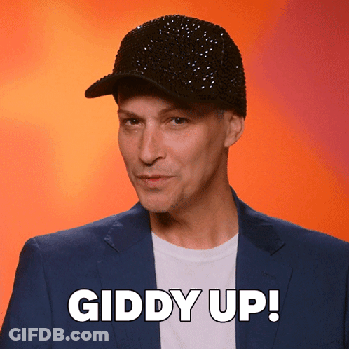 Man In Black Hat And Blue Suit Says Giddy Up GIF
